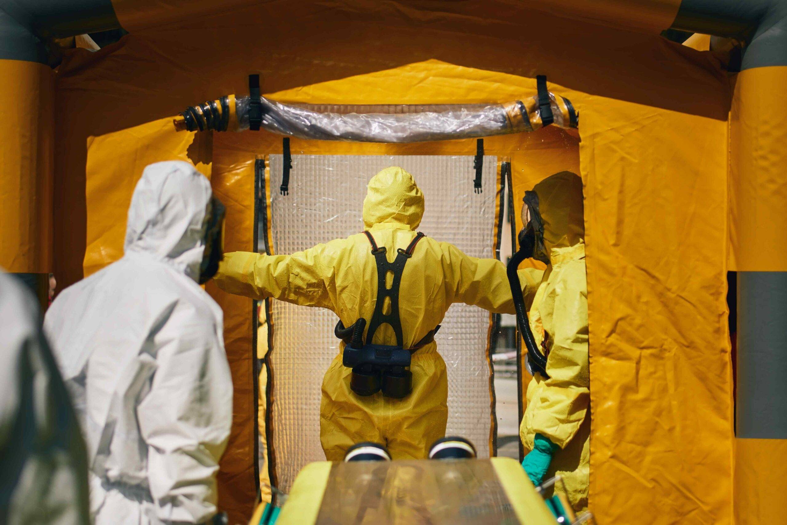 members of biohazard teams in protective suits 2022 10 18 00 31 05 utc scaled - Decon Solutions Australia Services