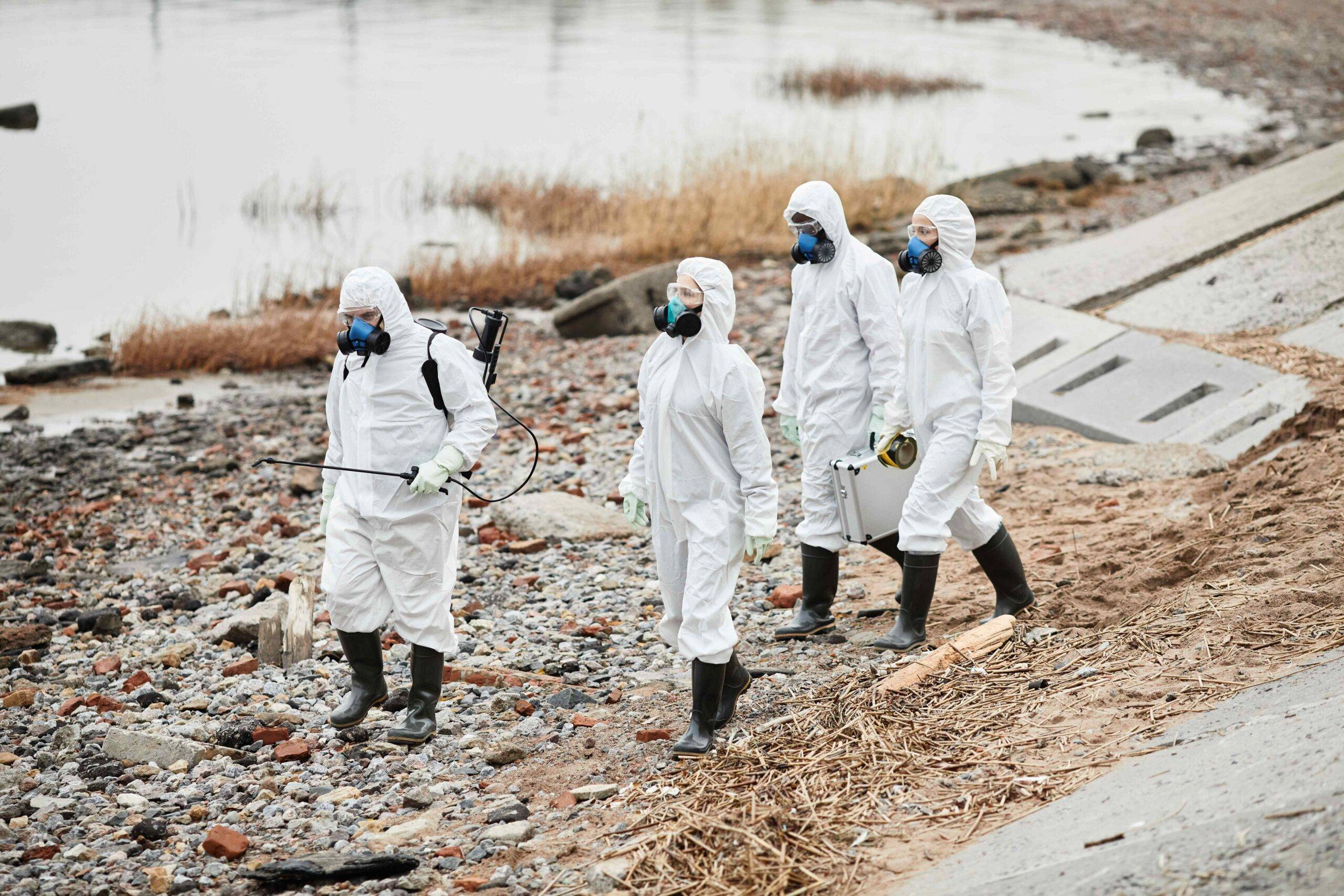 workers in hazmat suits at eco disaster site 2021 12 09 20 29 06 utc scaled - Decon Solutions Australia Services