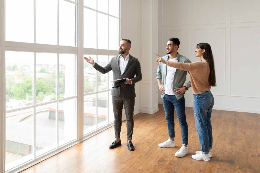 Property Manager Showing A Property to A Couple